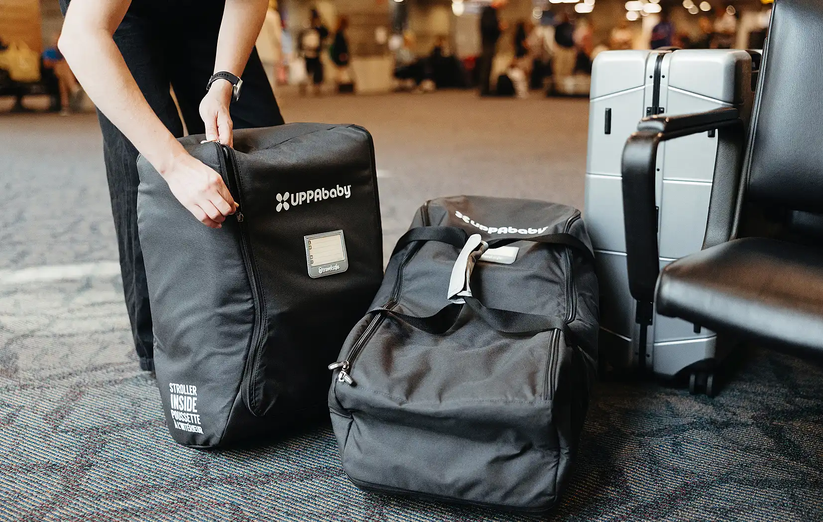 Parent using travel bag in airport